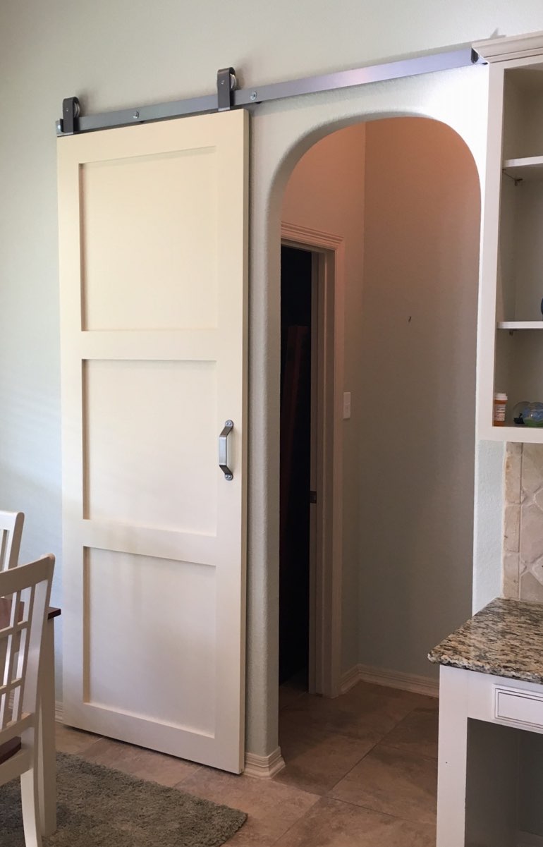 Quaker style barn door in Orlando kitchen.